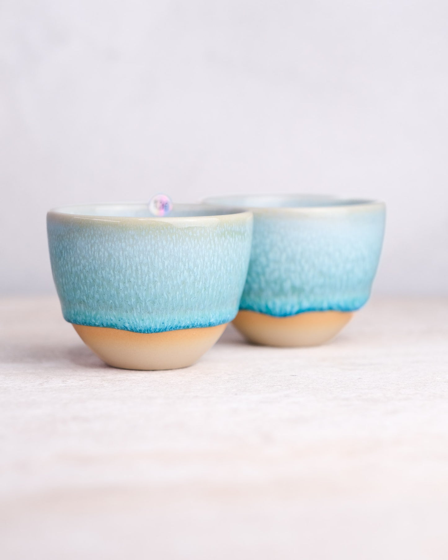 136. Pair of cappuccino 200ml, slipcasted