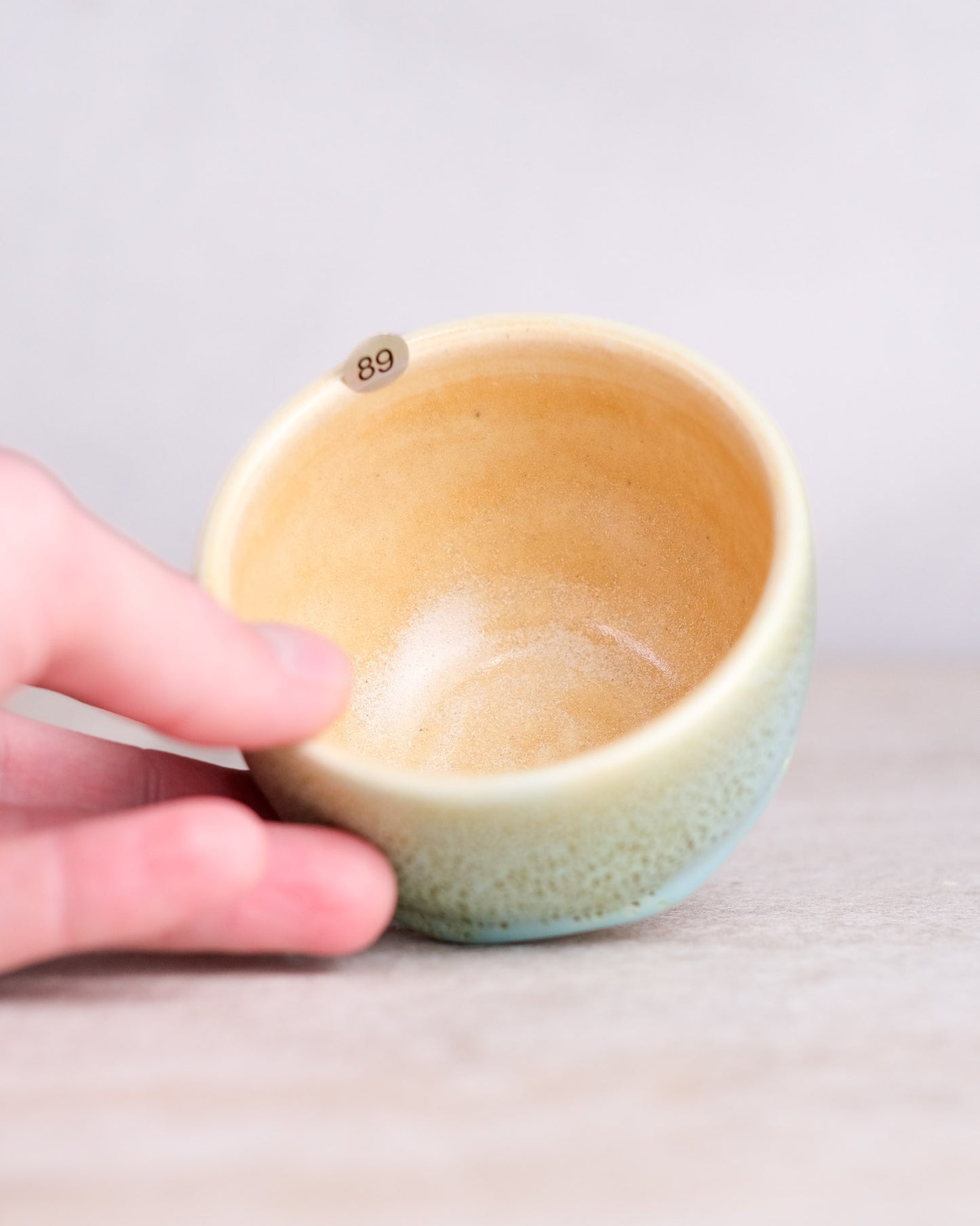 089. 160-180 ml cup, thrown, specific piece